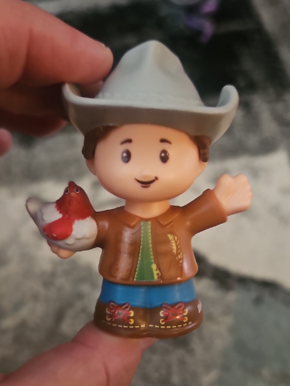 Fisher-Price Little People Farmer Jed figure holding a chicken